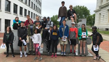 Students in front of "Democracy" sculpture in downtown Burlington