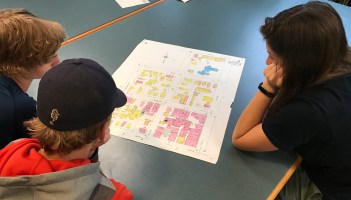 Students studying map of Burlington
