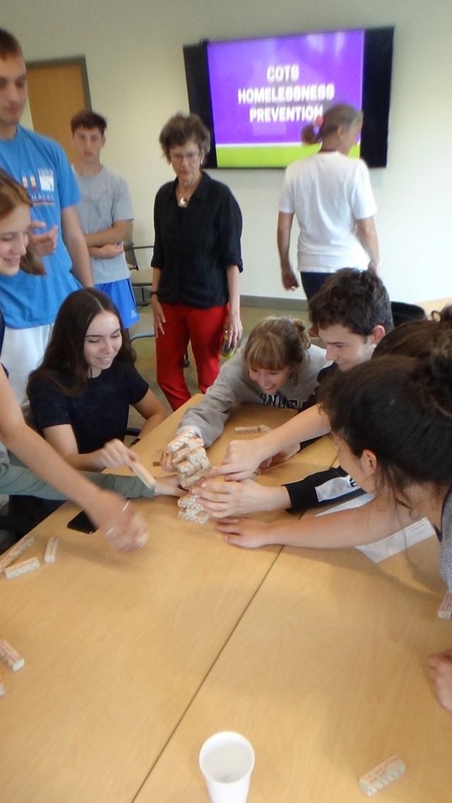 Students play a new kind of “Jenga” - in which each piece represents the life events that can cause a family to lose their home. A fun game about a terrible reality.