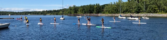 Students paddle on the lake.