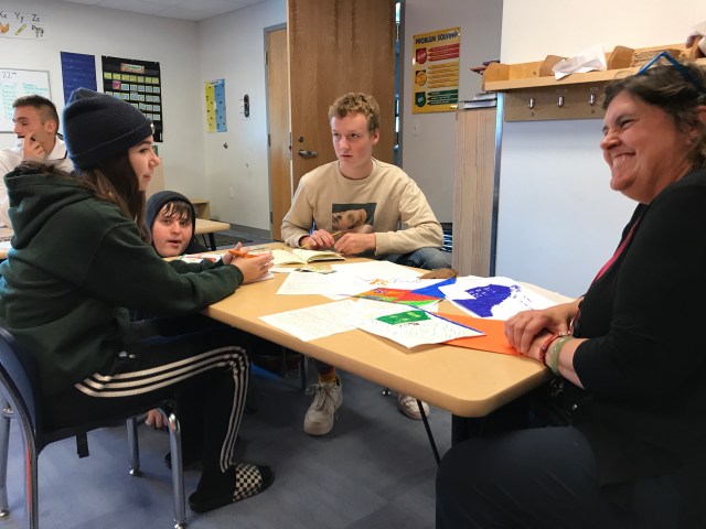 Students visit with Deena Murphy, at King Street Youth Center