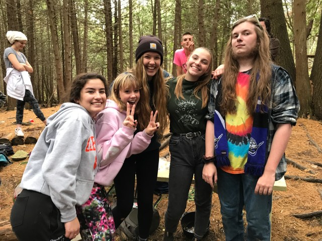 5 students smiling and looking at the camera