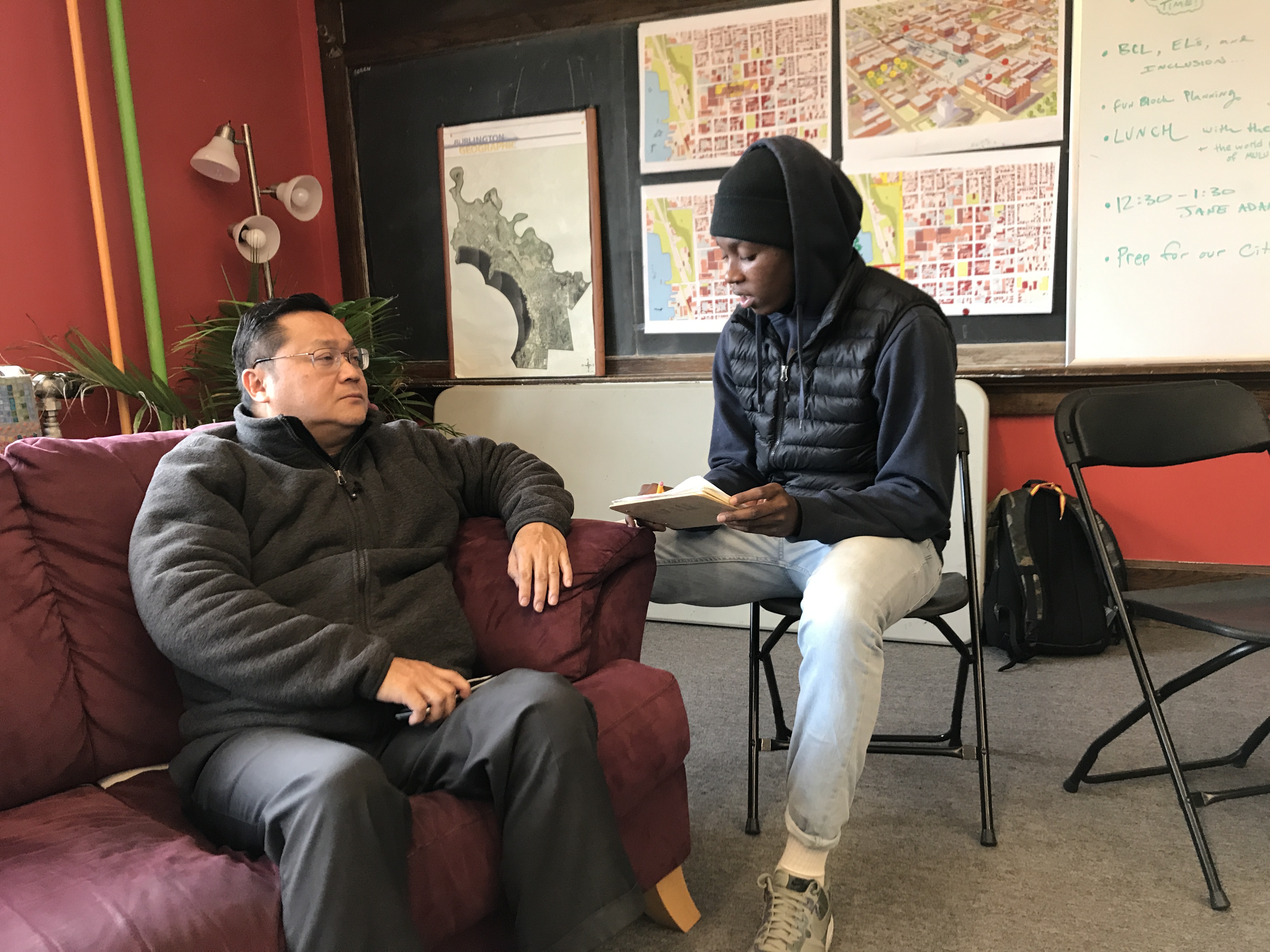 Young man interviews older gentleman