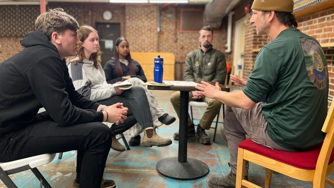 Neil Preston talks with students